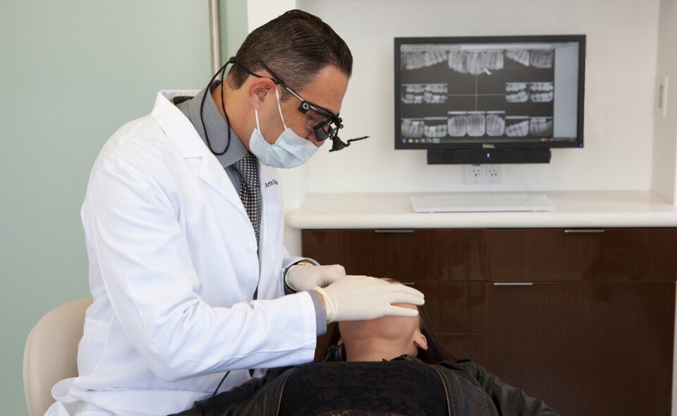 Dr. Glosman examining patient