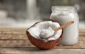 Fresh coconut oil on wooden table