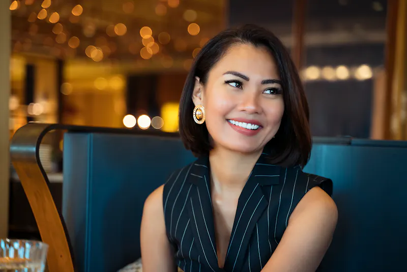 Woman sitting down smiling